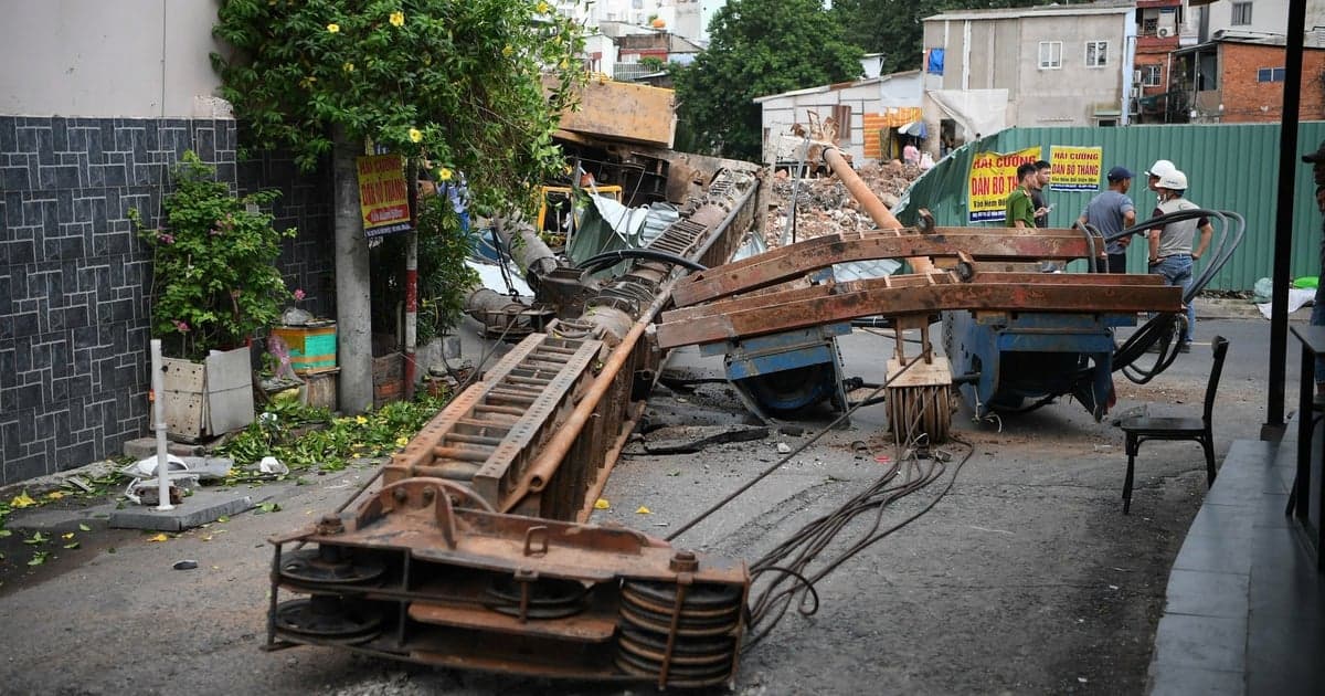 Construction machinery collapses onto the road at the Xuyen Tam canal project.
